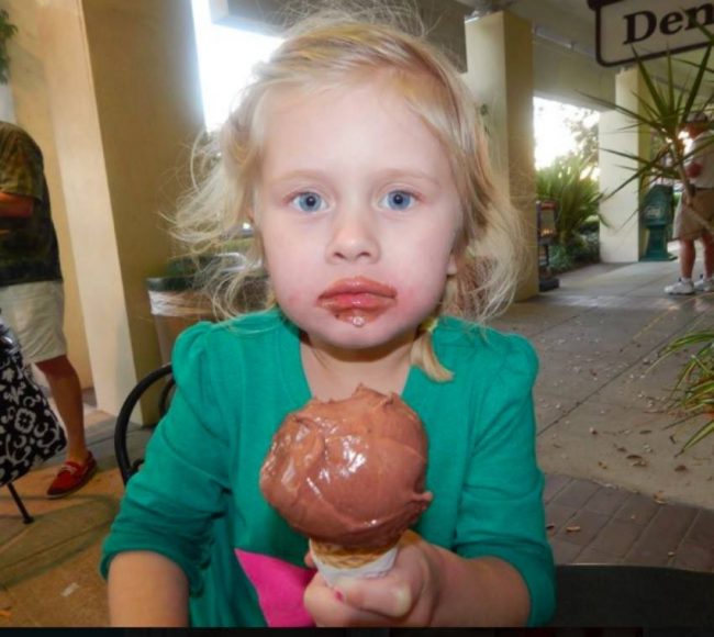 child eating chocoate ice cream